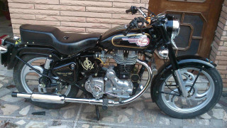 Motorcycle parked brick building door - a motorcycle free wallpaper