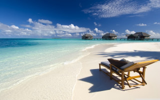 Beach chair table ocean huts 2 - a chair and a table free wallpaper