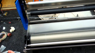 Person cutting paper scissors machine - paper free wallpaper