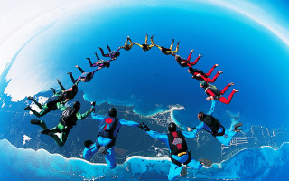Floating people circle water city - kitsch movement free wallpaper
