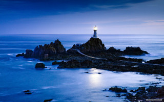 Lighthouse rocky shore night full 2 - a rocky shore free wallpaper