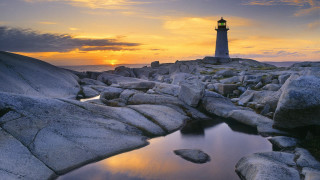 Lighthouse rocky shore sunset pond - a rocky shore free wallpaper