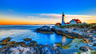 Lighthouse rocky shore sunset water - a rocky shore free wallpaper