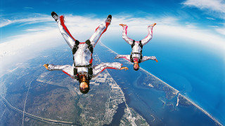 Skydiving white suits arms out - dynamic perspective free wallpaper