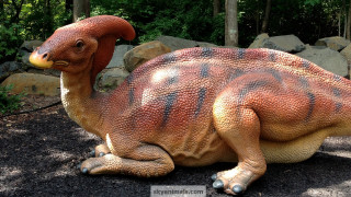 Dinosaur statue gravel field forest - real life skin free wallpaper