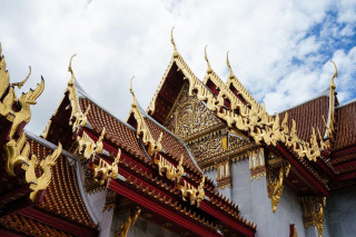 Gold decorated building sky clouds - detail free wallpaper