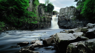 Waterfall rocks trees background nature - a waterfall in the middle of it free wallpaper