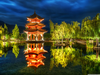 Pagoda lit night sky pond - symmetrical balance free wallpaper