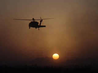 Helicopter sunset mountain flying sky - a helicopter free wallpaper