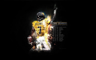 Football player holding football jersey - a football free wallpaper