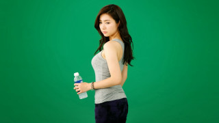 Woman holding water bottle cell - slim free wallpaper