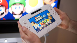 Person holding nintendo wii mario - a person holding free wallpaper