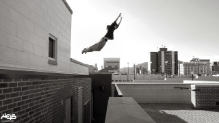 Person jumping skateboard city tall - a ledge free wallpaper