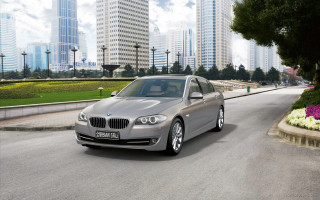 Silver car street tall buildings - flower and trees free wallpaper