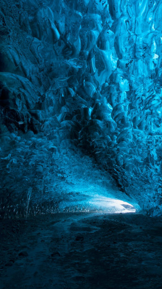 Man standing cave light blue 2 - a light free wallpaper