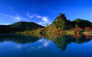 Lake mountain trees blue sky 6 - a mountain in the background and trees free wallpaper