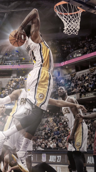 Basketball player dunking crowd watching 2 - a basketball player free wallpaper
