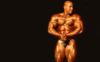 Muscular man shirtless posing dark 2 - david lazar free wallpaper