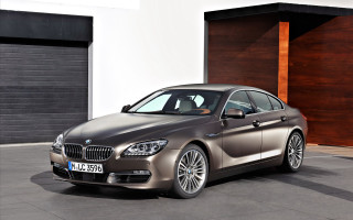 Silver car garage brown door - a silver car free wallpaper