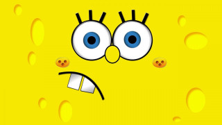 Yellow background frowning face circles - a face free wallpaper