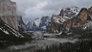 Mountain snow trees water clouds - a body of water below free wallpaper