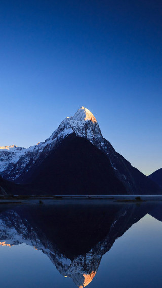 Mountain range lake dusk blue - a few cloud free wallpaper