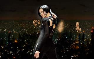 Woman black outfit cityscape night - a phone free wallpaper