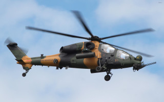 Helicopter flying cloudy blue sky - a propeller free wallpaper