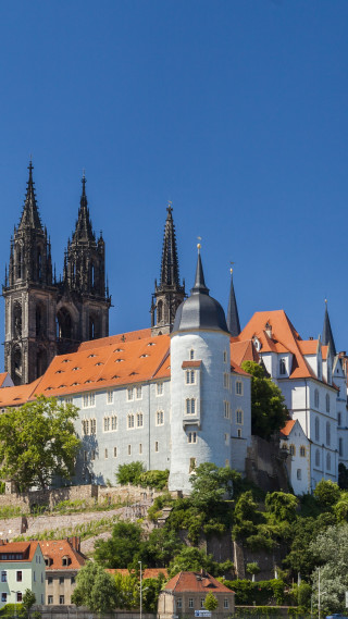 Castle red roof clock tower - a tilt shift photo free wallpaper