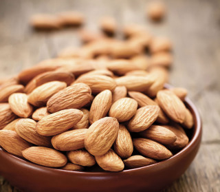 Bowl of almonds on wooden 2 - a spoon free wallpaper