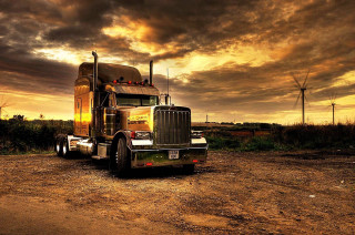 Semi truck dirt road windmills - a semi truck free wallpaper