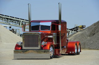 Red semi truck parking lot 5 - a red semi truck free wallpaper