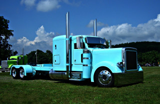 Blue semi truck parked field - color scheme free wallpaper