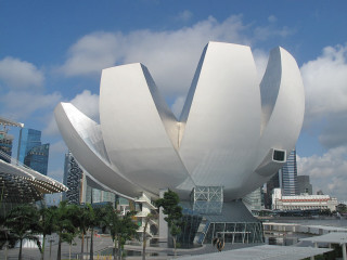 White flower sculpture cityscape skyscraper - a cloudy blue sky free wallpaper