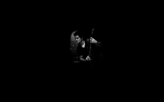 Man playing guitar dark background - eric taylor free wallpaper