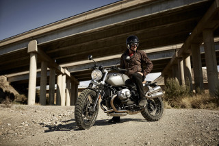 Man motorcycle dirt bridge building - daren bader free wallpaper