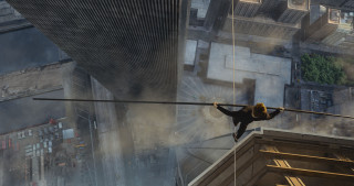 Man hanging high wire city - the building free wallpaper