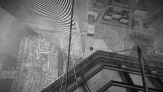 Black white photo building clock - a clock tower in the middle of its free wallpaper