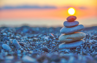 Stack rocks beach ocean sunset - a stack of rocks free wallpaper