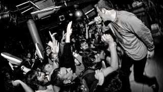 Man standing stage hands in - bedwyr williams free wallpaper