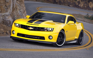 Yellow car winding road rock 2 - road free wallpaper