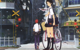 Man woman bike city street - a city street free wallpaper