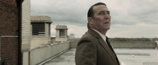 Man suit tie rooftop looking - a building in the background free wallpaper