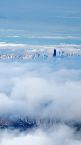 City clouds skyscraper distance view - free city wallpaper