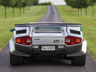 Silver sports car road grass - a house in the background free wallpaper