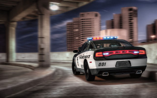 Police car night city tall - a street in a city free wallpaper