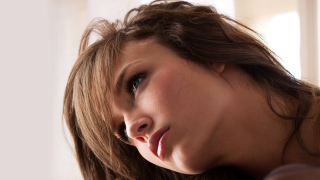 Woman long hair serious look 6 - her face and shoulder free wallpaper