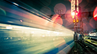 Train moving tracks night time - the light free wallpaper