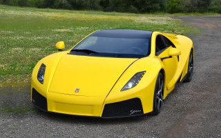 Yellow sports car gravel road - a grassy field free wallpaper
