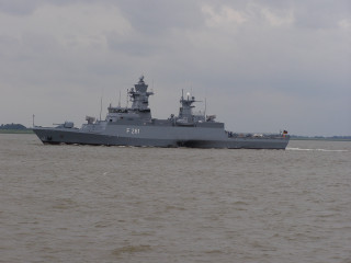 Battleship shoreline boat cloudy sky - top of a body free wallpaper